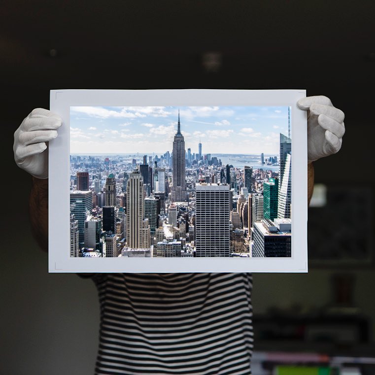 person holding an archival print