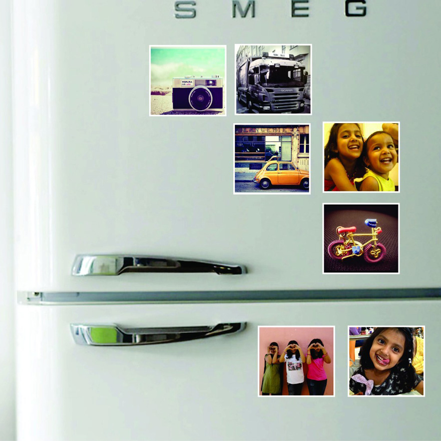 family photos on a white fridge