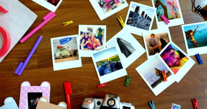 group of many polaroid style magnets on a table