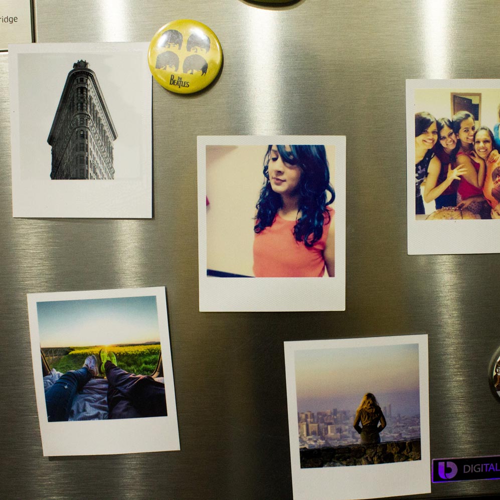 magnets of family on fridge