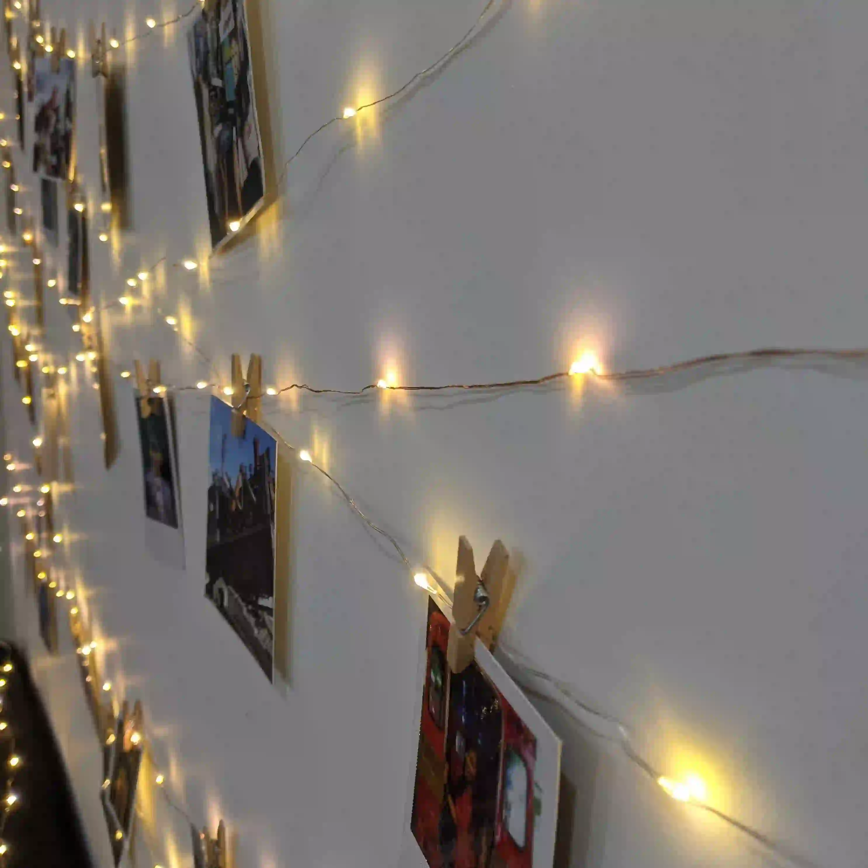 hanging polaroids for romantic room decor
