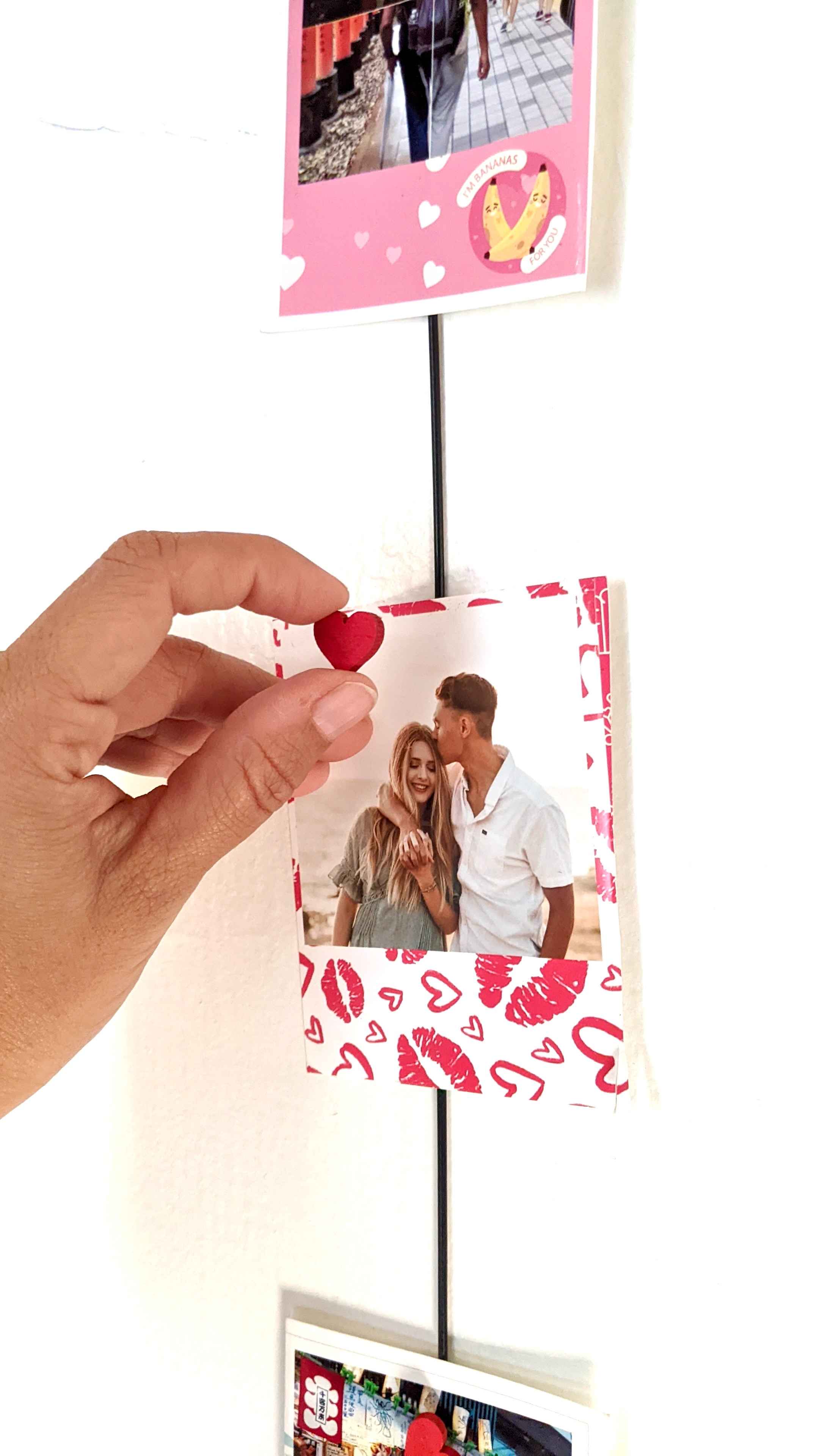 Valentine theme polaroid prints on hanging photo rope